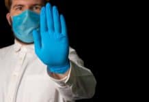 COVID-19 Propaganda: Truth or Fiction? Man wearing mask & gloves