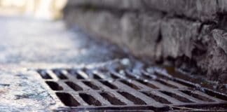 Rain water falling into sewerage drainage system