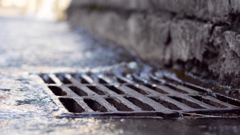 Rain water falling into sewerage drainage system