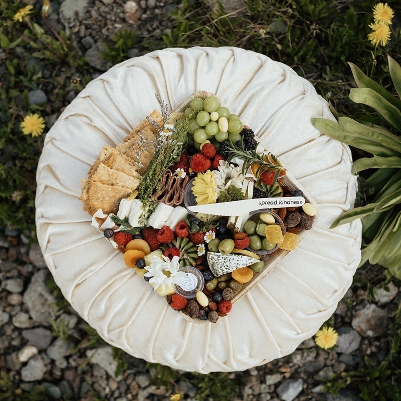Bramble & Brie Charcuterie Co.'s Signature Box including house made tomato jam and sourdough crackers as well as spiced nuts and olives.