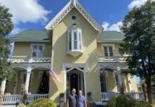 Mark Lansing Jeremy Couture in front of Inn at Woodhaven