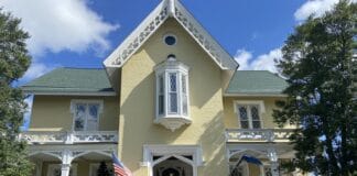 Mark Lansing Jeremy Couture in front of Inn at Woodhaven