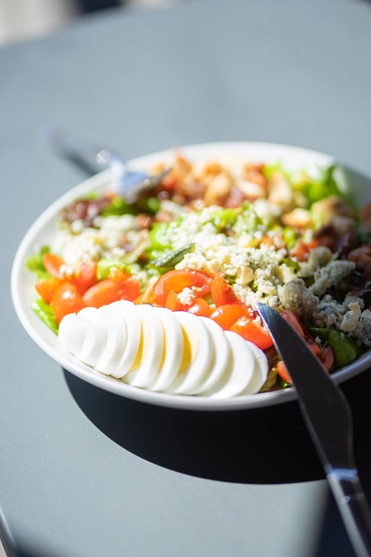 Colorado Craft Social Cobb Salad with Emerge aquaponic mixed green lettuce, Nueske's applewood smoked bacon, cherry tomatoes, hard boiled farm egg, grilled marinated chicken breast, blue cheese and herbs