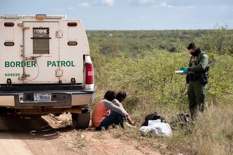 Illegal Alien Border Patrol agent uses PPE prepares to transport 2 individuals 08122020