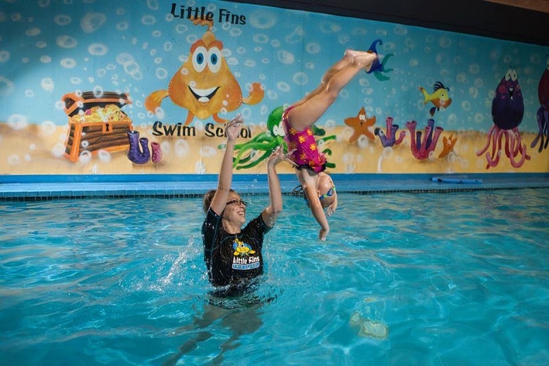 Little Fins Swim School Instructor Ms. Cori flipping Presley Lauri Armstrong Daughter test for safety