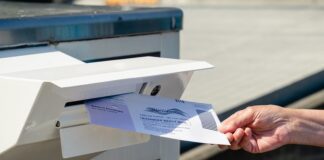 Dropping Mail in a Ballot into Mailbox
