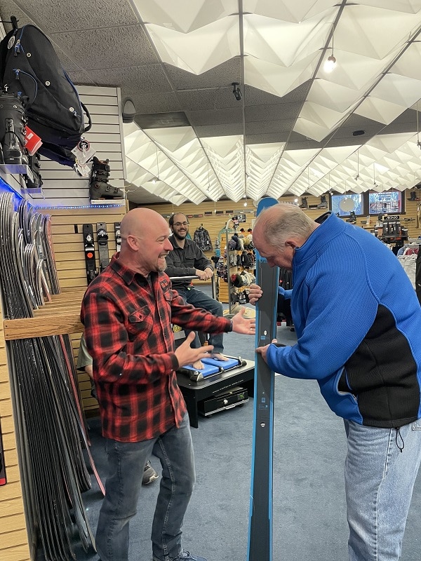 Ski Shop Inc. Rick Uhl with a Customer
