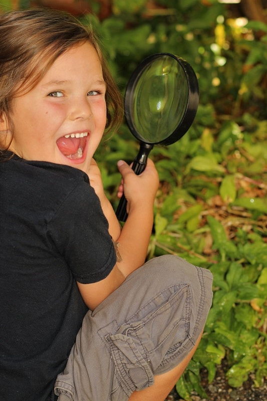 Project-Based Learning Kid with Magnifying Glass