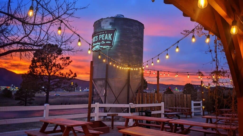 The outside beer garden with the mountains in the background at Pik's Peak Brewing in Monument