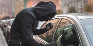 Man Trying to Break Into Car