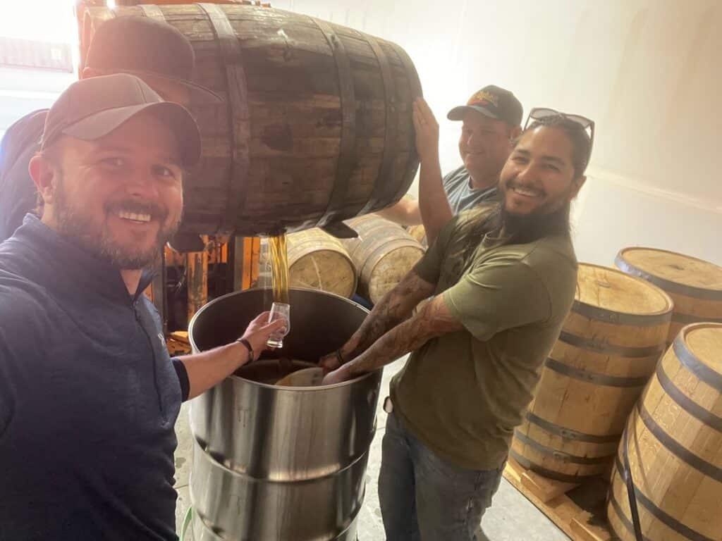 Owner Brent Baldwin of Veterans Wine & Liquor in Colorado Springs trying some whiskey right off the barrel