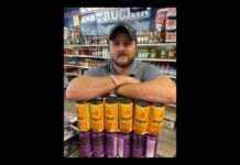 Owner Brent Baldwin of Veterans Wine & Liquor in Colorado Springs holding some product from local brewer Bell Brothers Brewing.