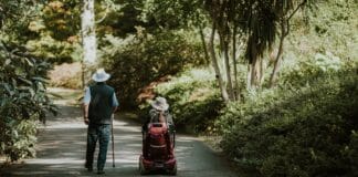 Woman in Wheelchair Man with Cane