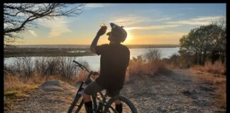 Artist Manuel Pulido riding on his mountain bike.