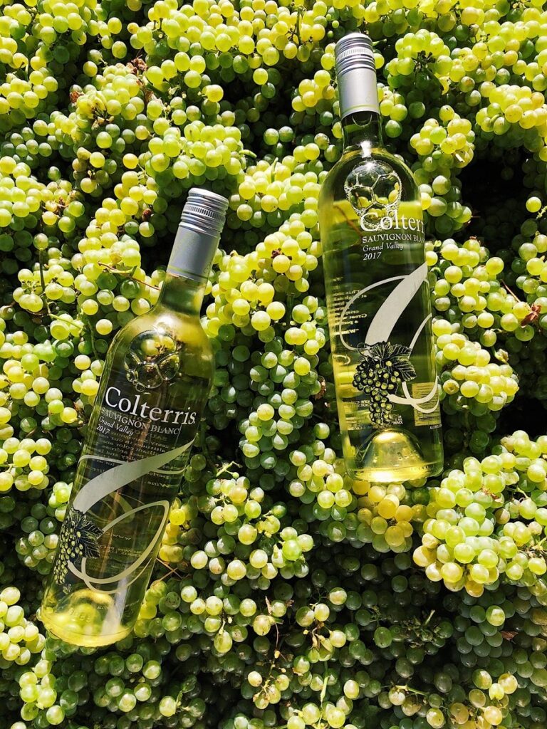 Colterris Winery  Winery Grand Valley Cabernet Sauvignon surrounded by grapes.