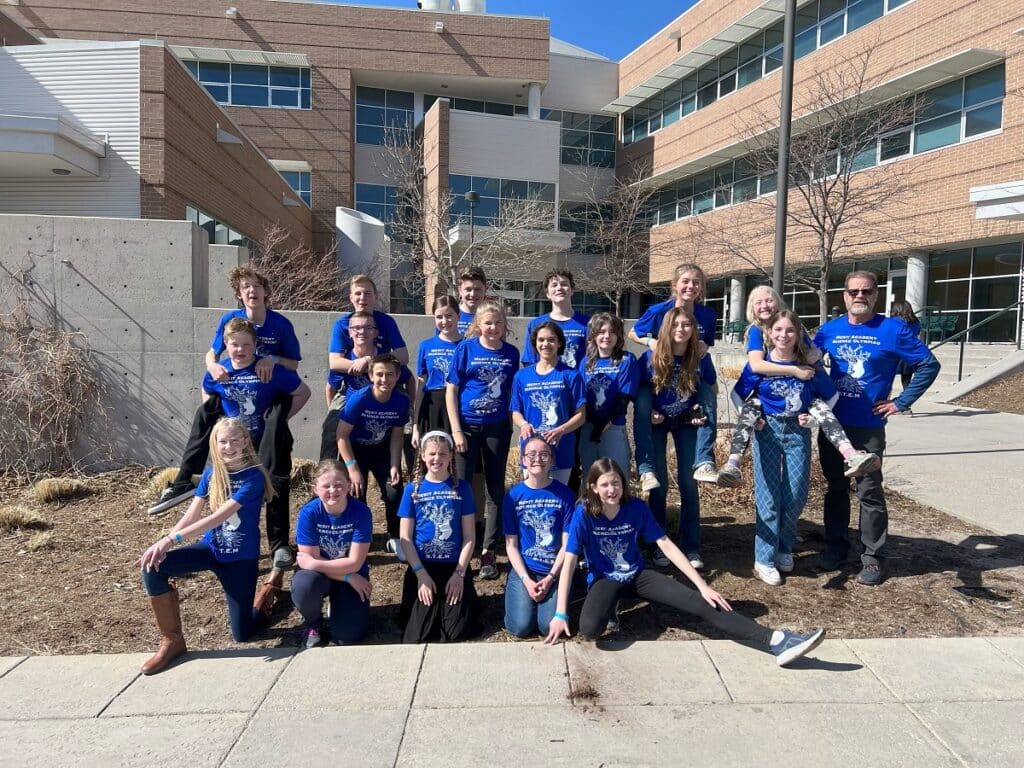 Merit Academy Students in front of Merit Academy