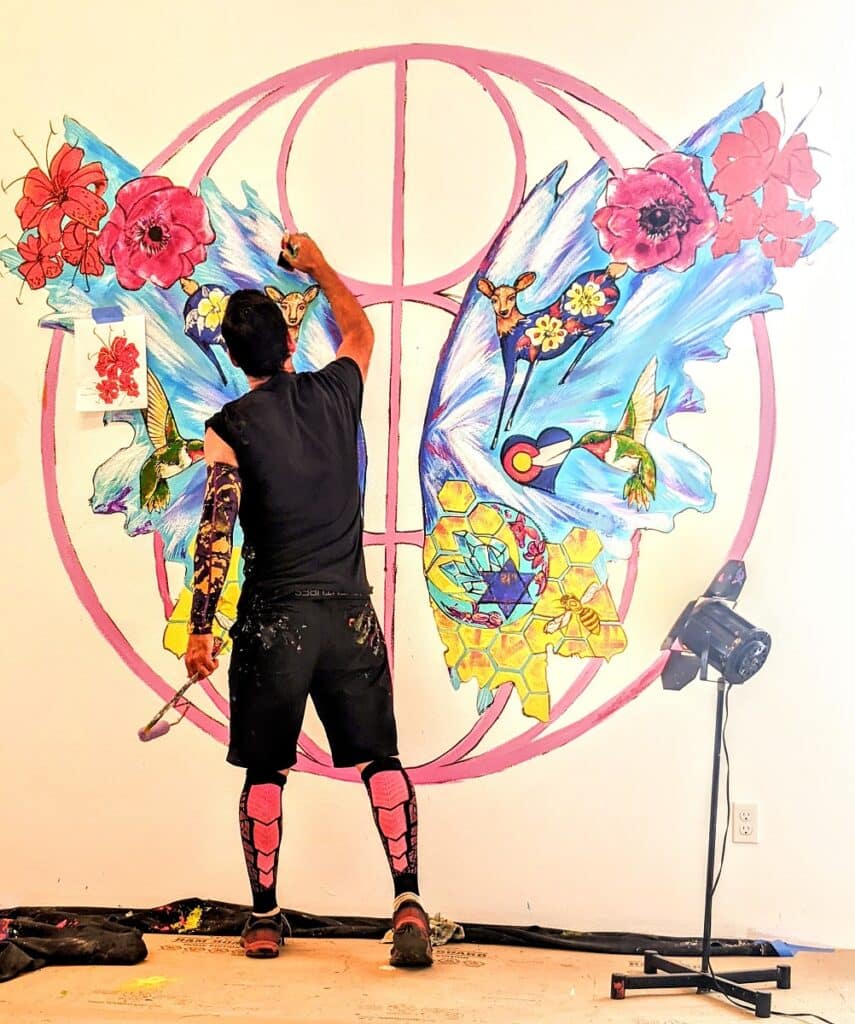 Jaguart Art Artist Diego Arnedo of Jaguart Art Experience painting inside a studio in Colorado Springs.