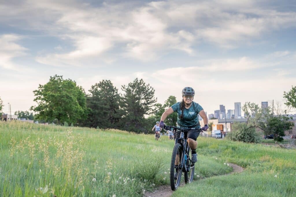 Mountain Biking Natalia Pulido out riding her mountain bike on trails.