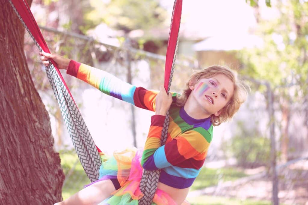 Queer Kid in Rainbow Shirt